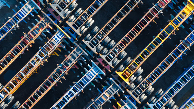 Aerial view of rows of colorful shipping container chassis parked in a logistics yard in Columbus, Ohio, United States.