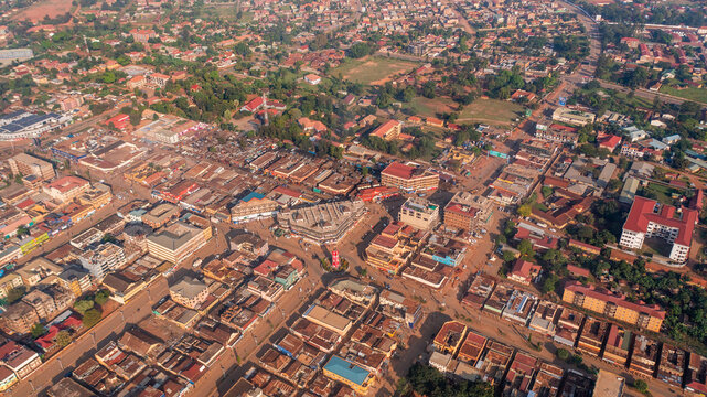 Aerial view of the urban landscape featuring dense buildings, rooftops, and road networks in Mbale, Eastern Region, Uganda.