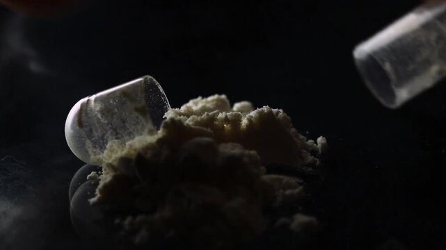 Macro close-up of pharmaceutical powder spilling from an opened capsule