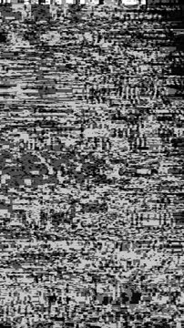 Abstract grayscale white noise glitch background with heavy pixel distortion and scanline interference flickering on a seamless loop. Anchors an industrial analog video transition and vintage.