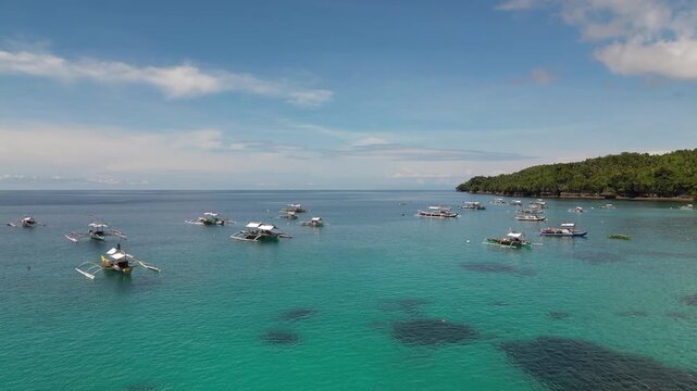 Boats Drift On Tropical Bright Blue Lagoon Samal Island Davao Philippines Drone Track In 4K 30FPS