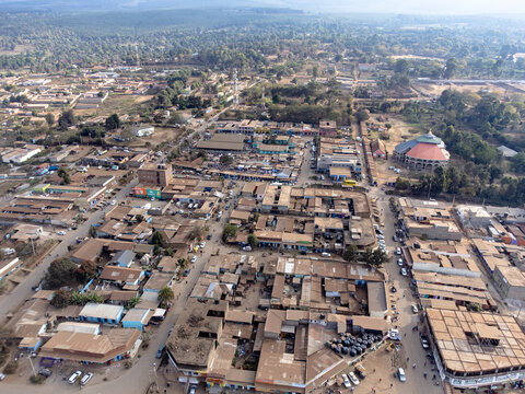 Aerial view of the town featuring low-rise buildings, busy streets, and surrounding dry landscape in Loitokitok, Kajiado County, Kenya.