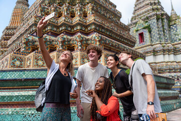 Friends exploring ornate temple architecture.
