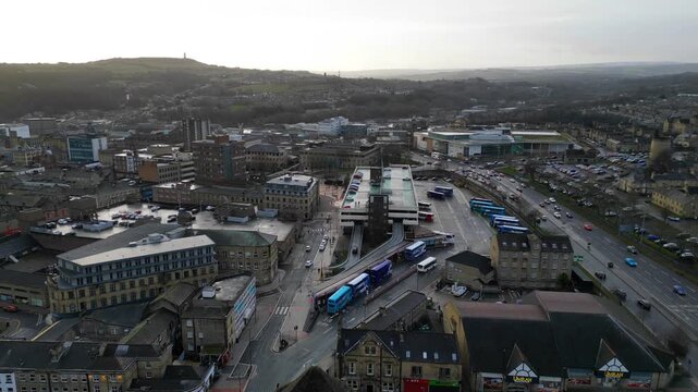 Drone shot of Huddersfield bus terminal, train station, and ring road traffic