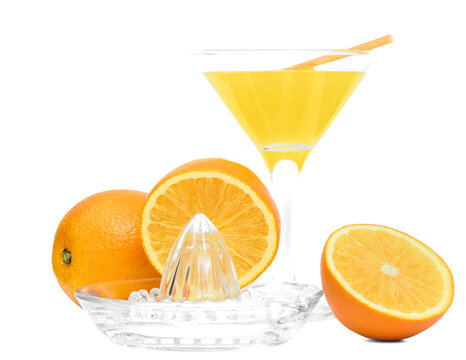 Juicy sweet oranges and freshly squeezed juice in a glass isolated on a white background