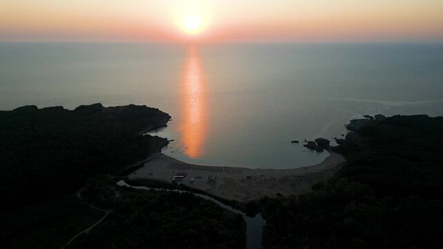 Drone Flying Forward Over Silistar Beach Bay at Golden Sunrise Sunset