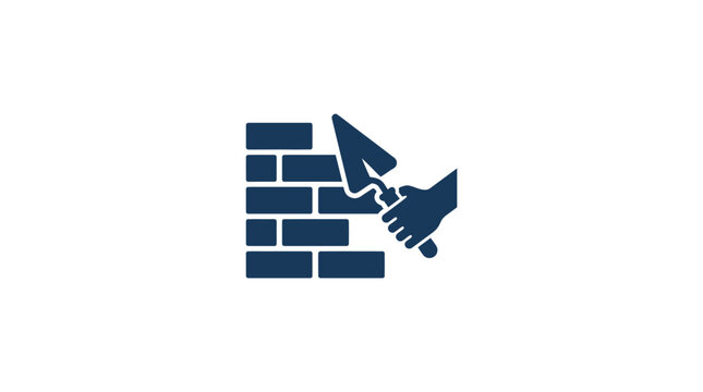 Hand breaking through brick wall.