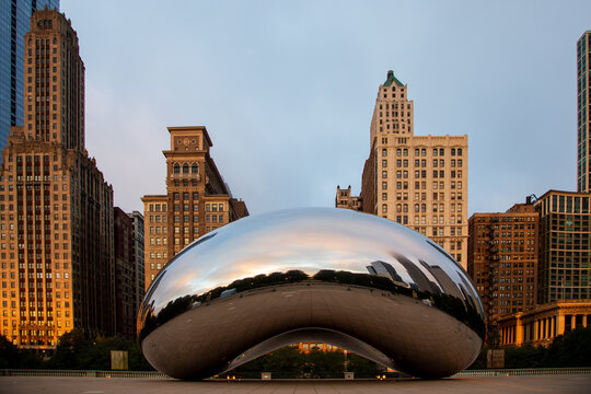 Chicago, Illinois, USA, October 1, 2024 - The 2006 Cloud Gate bean-shaped sculpture by Anish Kapoor in downtown Millennium Park seen at dawn