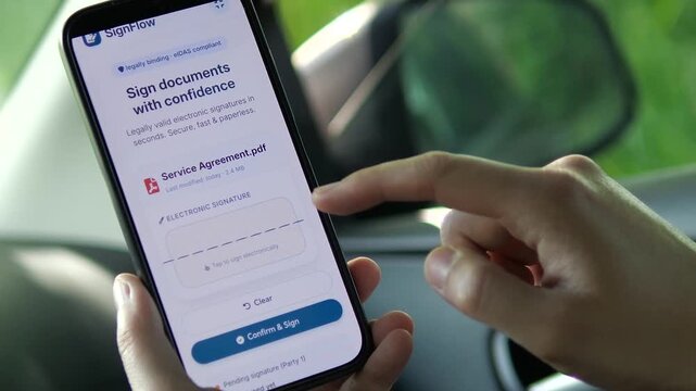 Electronic signature is added and confirmed on a mobile agreement, highlighting legal tech, faster onboarding and the shift toward secure paperless decision-making.