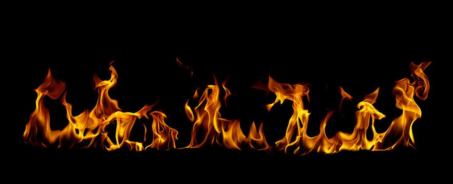 Realistic fire flames isolated on black background featuring blazing orange and yellow fire with dramatic heat effect Ideal for fire overlay, burning effect energy danger, and graphic design projects.