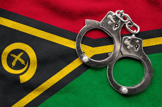 Flag of Flag of Vanuatu  and police handcuffs. Crime and offenses in country Concept
