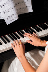 pianist female hands wearing jewelry playing piano © Елизавета Фильченко