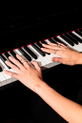 pianist female hands wearing jewelry playing piano © Елизавета Фильченко