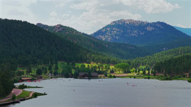 Evergreen Lake House aerial drone Evergreen Colorado foothills Denver Golf Course paddleboarding canoe boat Upper Bear Creek Front Range Rocky Mountain summer spring sunny cloudy morning static