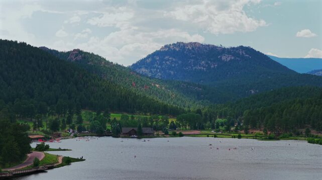 Evergreen Lake House aerial drone Evergreen Colorado foothills Denver Golf Course Upper Bear Creek Mt Blue Sky Front Range Rocky Mountain summer spring sunny cloudy morning paddleboarding upwards
