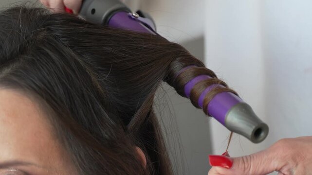 Professional Hair Styling Curling Iron Beauty Salon Creating Perfect Spiral Curls Close Up