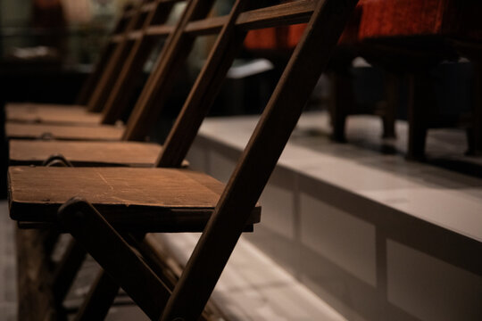 Row Wooden Chairs Inside Dimly Lit Auditorium