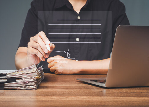 Electronic signature on digital document at office desk