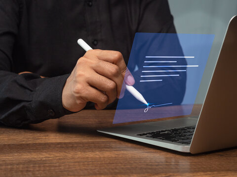 Electronic signature on laptop with digital document