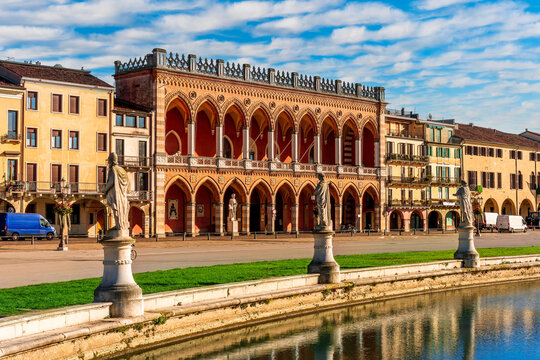 beautiful city view of an urban landscape with park chanel with blue water and monuments and historic european buildings on background. Autumn season city landscape