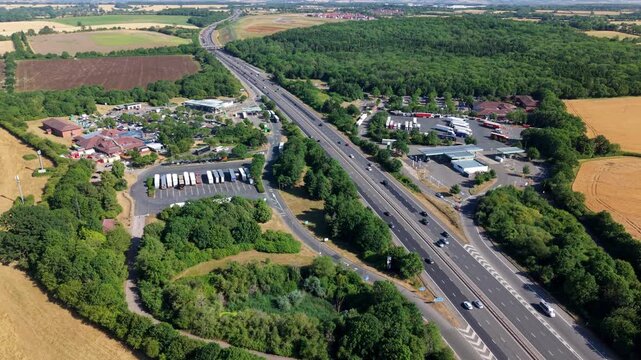 Aerial view of Welcome Break Warwick Northbound Services M40 located along the M40 motorway surrounded by green fields and trees in Warwick, England, United Kingdom.