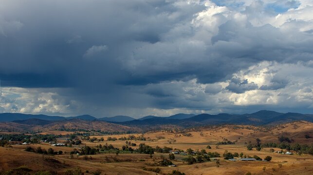 Beautiful and breathtaking view of rain over distant hills. Landscape of rainy hamra over hills.