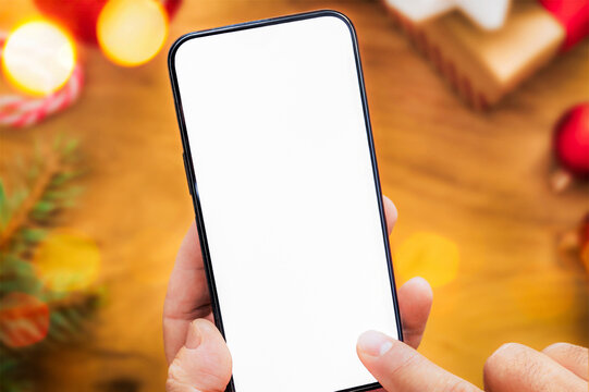 Hand Holding Smartphone With Blank White Screen