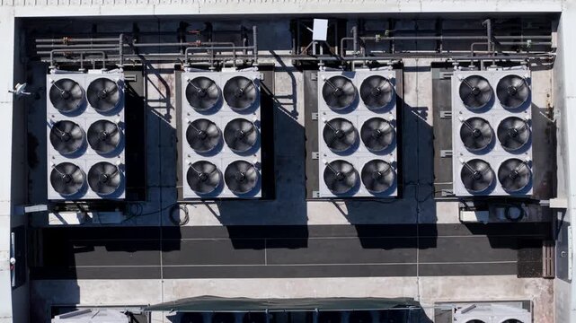 Aerial view of data center ventilation cooling fans on a rooftop in Redditch, England, United Kingdom.