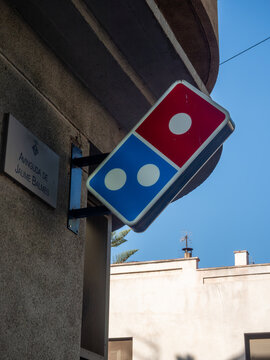 dominos pizza outdoor hanging sign wall mounted street view