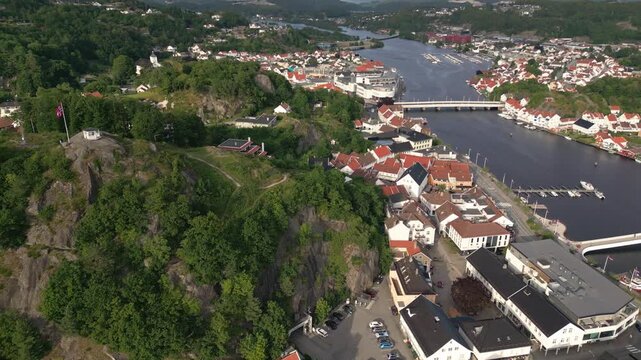 Aerial view of the town of Mandal with its river, bridge, and historic buildings in Mandal, Agder, Norway.