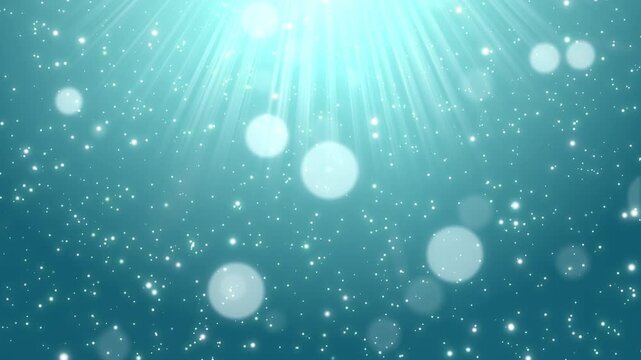 美しいブルーグリーンの背景に差し込む光とキラキラの粒子が舞うループ動画素材 / Beautiful blue green background with glowing light rays and sparkling particles loop video