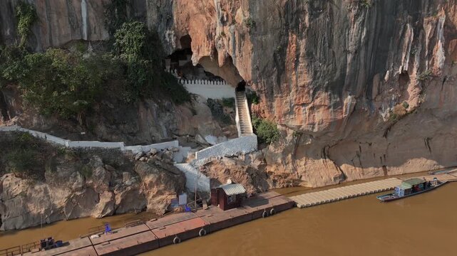 Buddhist shrine in Pak Ou Caves, Tham Tring cave, confluence of the Ou and Mekong rivers, Luang Prabang, Laos. Aerial