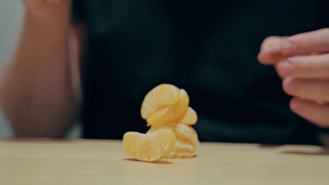 Taking Mandarin Segments by Hand, Healthy Eating and Portion Choice