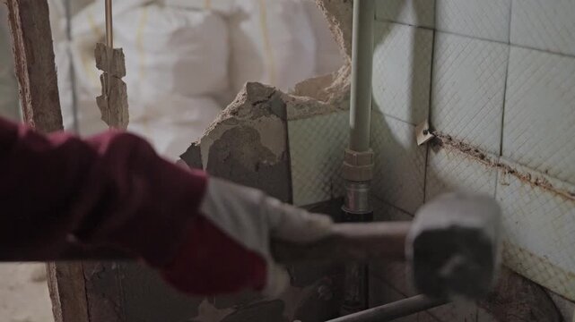 Powerful demolition work captures dust and impact during home renovation