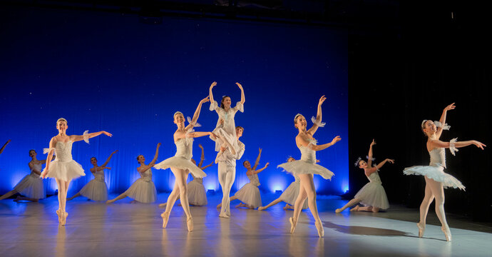 Ballet dancers perform a lifted scene from a traditional holiday
