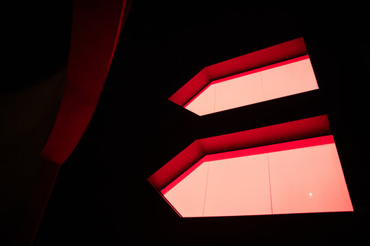 Modern architecture featuring illuminated red windows