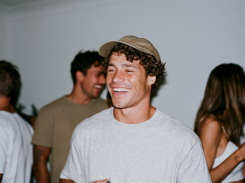 Three Happy Friends Laughing Together at Outdoor Night Event or Party