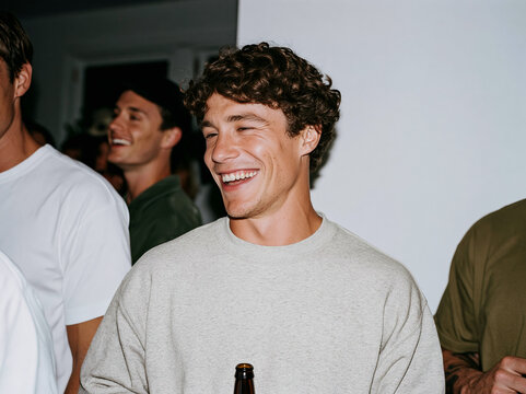 Three Happy Friends Laughing Together at Outdoor Night Event or Party