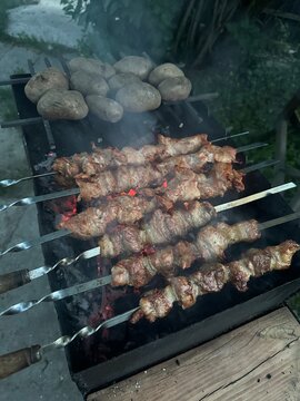 coal roasted potatoes and juicy pork skewer