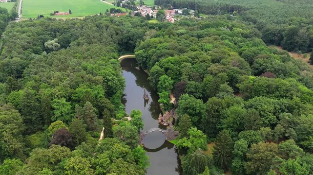 Rakotzbr&uuml;cke stone arch bridge over pond in Kromlau park