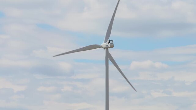 Runkel, Hessen, Germany - 23 July 2026: Aerial view of a vestas wind turbine rotating against a cloudy sky.