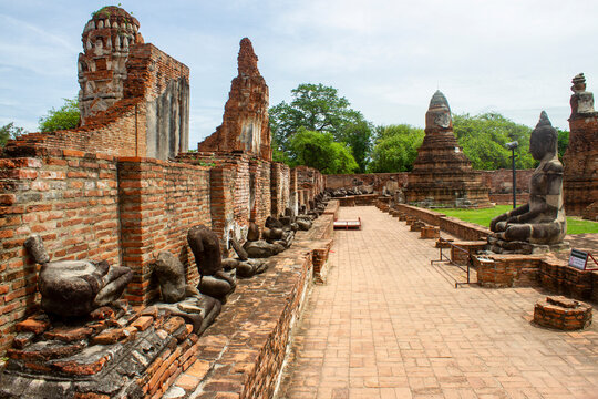 Broken Buddha Statues at Historical Ruins of Wat Mahathat Temple in Ayutthaya Ancient Capital, Thailand. This Is One of the Most Important Temples in Ayutthaya Historical Park.