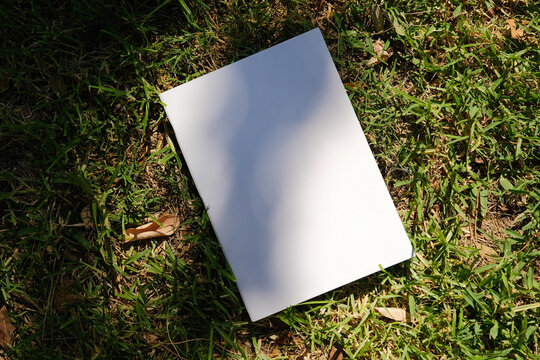 Mockup magazine on green grass background
