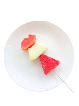 slices of watermelon, melon and papayas