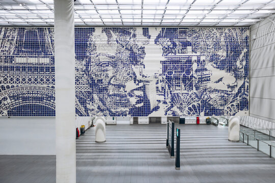 Paris, France - January 28, 2026: Monumental blue and white Eiffel Tower tile mural inside the Paris Orly Airport station on Metro Line 14