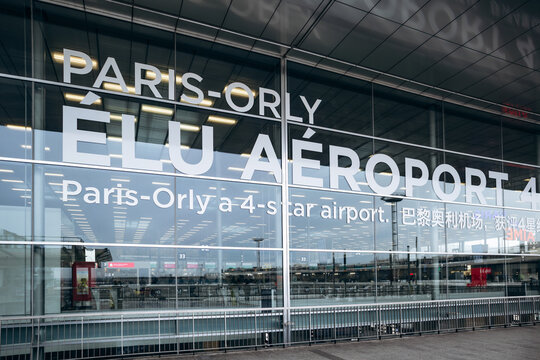 Paris, France - January 28, 2026: Exterior view of Paris Orly Airport Terminal 4 facade with the prominent "Paris-Orly &Eacute;lu A&eacute;roport" signage.