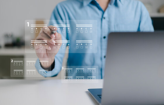 Business professionals use laptops to approve test requests, evaluate online documents, conduct paperless online surveys, and conduct online exams.