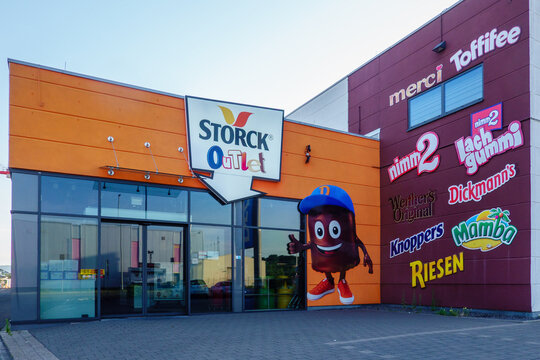 Mulheim-Karlich, Germany - July13, 2026: Storck Outlet building exterior showcasing various candy brand logos like Merci, Toffifee, Werther's Original, Knoppers, Riesen, nimm2 and Mamba