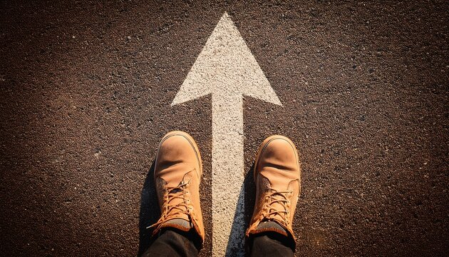 shoes on road with straight arrow showing forward direction