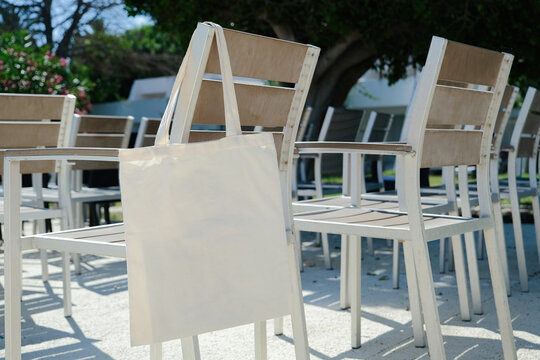 Canvas tote bag mockup on chair outdoors